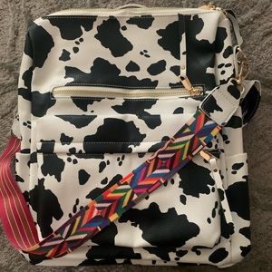 Cow print backpack with removable strap
